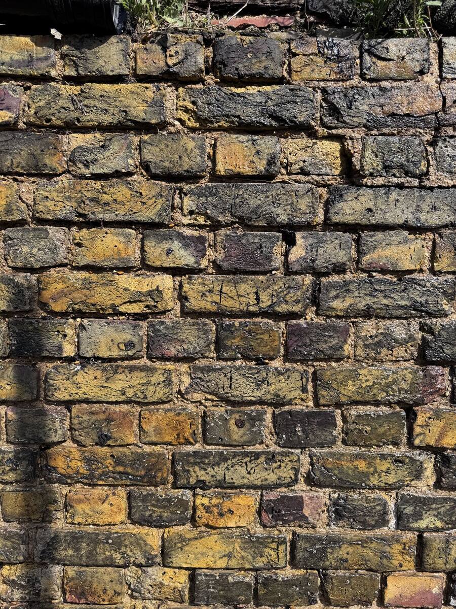 Original varied colours of London stock brick emerging after cleaning